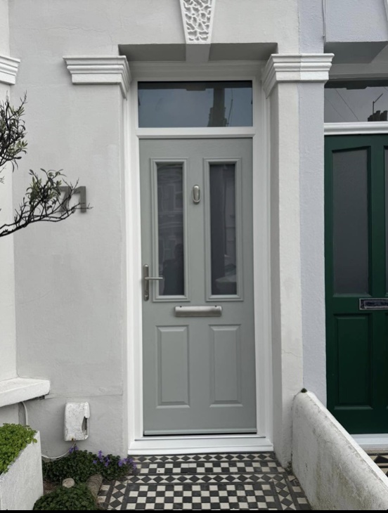 Grey composite front door with glazed panels and a fanlight
